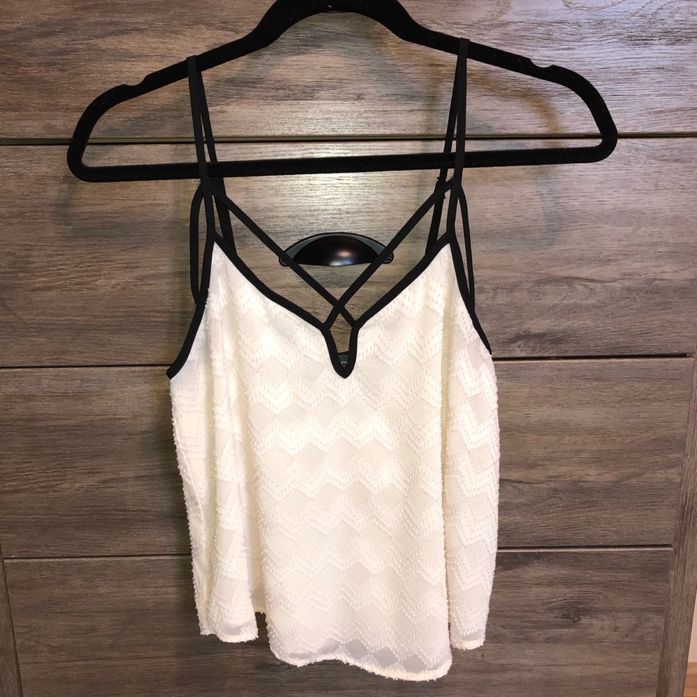 Super cute! Textured beige top with black detail